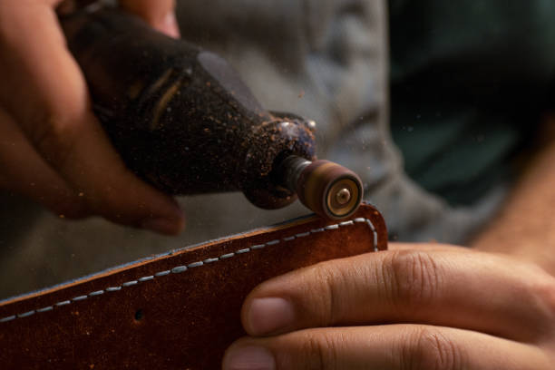 Buffing and burnishing the edge of a stitched leather belt